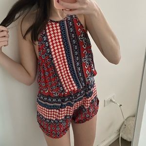 Red printed romper. Size 8 fits m-l. Perfect condition, never worn